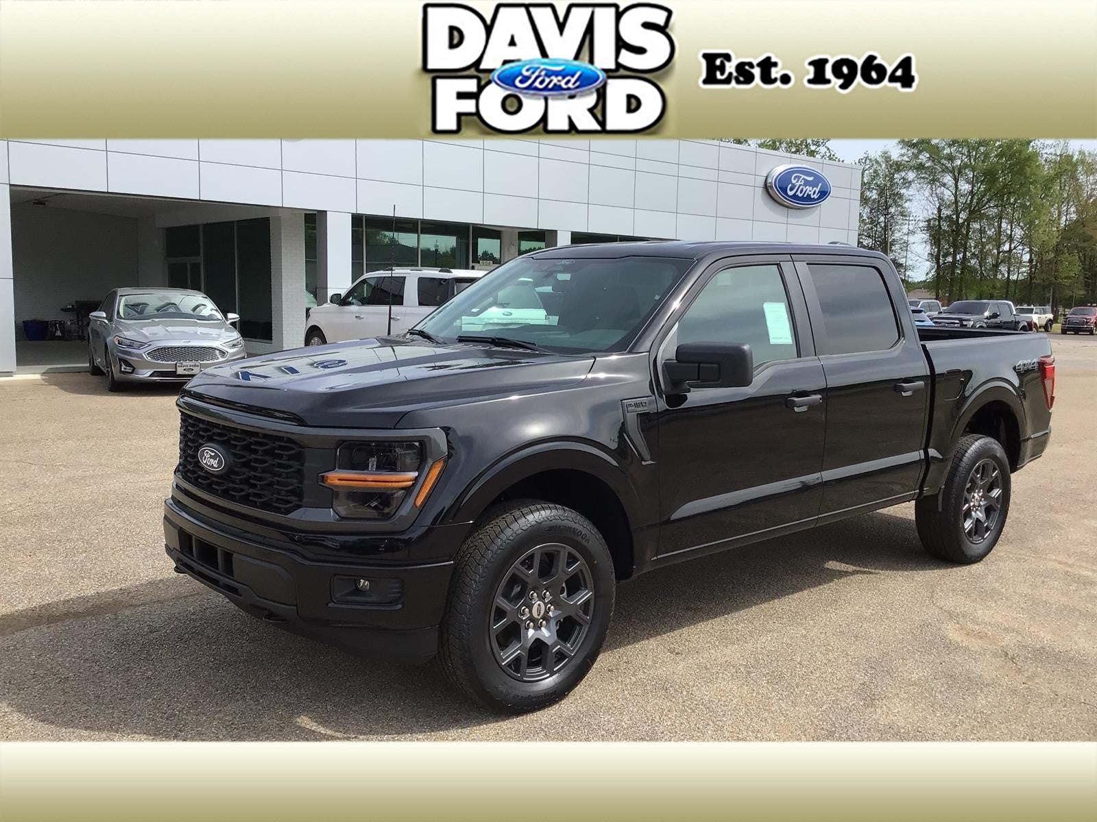 2026 Ford F-150 STX in Agate Black Metallic — front three-quarter view