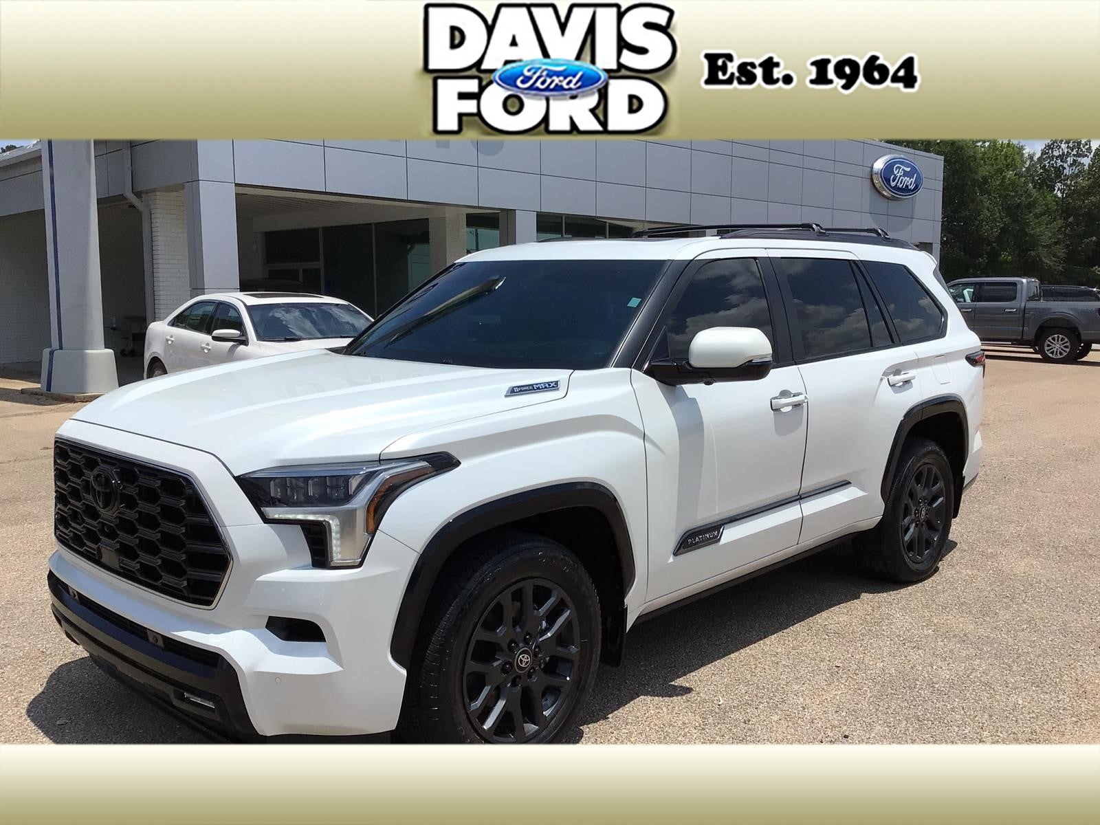 2025 Toyota Sequoia Platinum in White — front three-quarter view